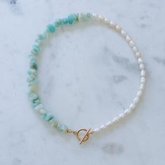 Half and half necklace including dainty rice pearls, multicolored-turquoise amazonite gemstones, and a 14k gold plated toggle clasp. Necklace is 14 inches in length. Half And Half Necklace, Beach Necklace Aesthetic, Beachy Necklaces, Beachy Necklace, Coastal Jewelry, Hawaii Jewelry, Beachy Jewelry, Beach Necklaces, Ocean Jewelry