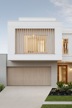 a white house with wooden slats on the windows