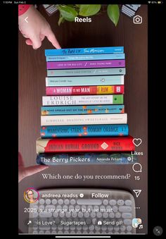 a stack of books sitting on top of a computer keyboard