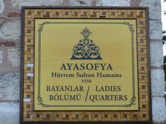 a sign on the side of a building that says ayesoya hirrem sultan hammau