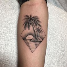 a black and white photo of a palm tree on the arm