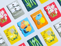 many different colored cards with flowers on them