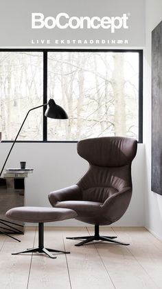 an egg chair and ottoman in front of a window with the words booconcept on it