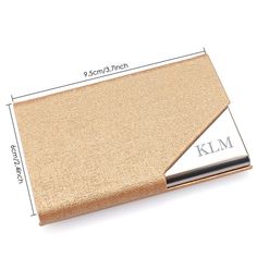 a women's wallet is shown with the name klm in silver on it