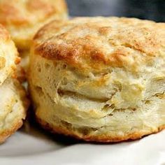 two biscuits sitting on top of a white plate