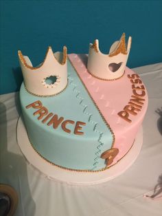 there is a cake that has two crowns on it and the words prince and princess