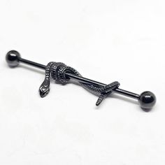 a black and silver colored metal bar with an octopus on it