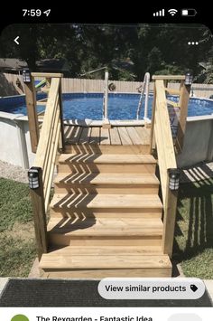 a wooden staircase leading up to a swimming pool