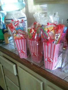 several bags of candy sitting on top of a counter