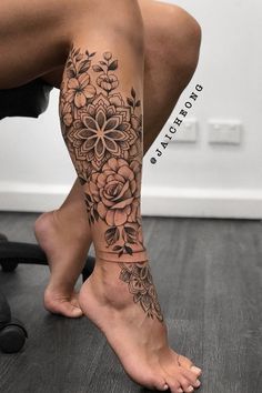 a woman's leg with flowers on it