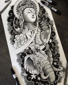 an elephant and buddha tattoo design on paper