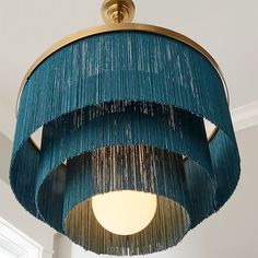 a blue chandelier hanging from the ceiling