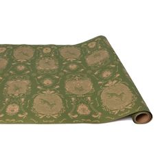 A paper roll table runner featuring a toile-style illustration of detailed filigree around vignettes containing forest animals, all in monochrome green printed on tan kraft paper. Wallpaper Table, Engagement Games, Chicago Gifts, Paper Table Runner, Miscellaneous Gifts, Garden Frame, Spring City, Paper Table, Blue Q