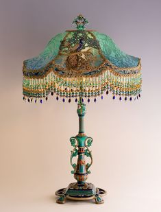 an ornate lamp with a blue shade on it