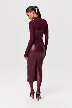 Our stretchy faux leather midi dress is a winter essential. Features a tube design with a straight neckline and a body-con finish. Back zipper closure makes it simple to put on. Style with our amazing boots and coats to create must-have outfits. Vegan Leather Collection Import Self: 60% PU, 35% Rayon, 5% Spandex Lining: 80% Nylon, 20% Spandex Model wears size XS True to size Leather Dress Outfit Night, Leather Dress With Boots, Long Sleeve Leather Dress, Leather Dress Outfit, Tube Midi Dress, Leather Midi Dress, Burgundy Midi Dress, Tube Design, Mesh Long Sleeve