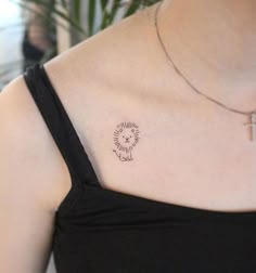 a woman with a small tattoo on her chest