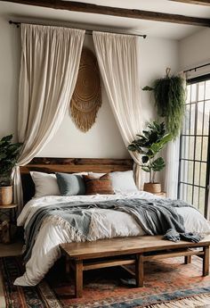 a large bed sitting next to a window in a room with lots of plants on the wall