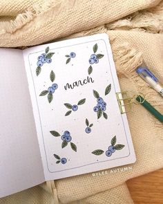 an open notebook with the word march written on it