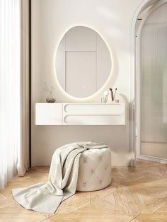 a white bathroom with a round mirror on the wall and a stool next to it