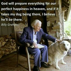 an old man sitting in a chair next to a white dog with a bible on it