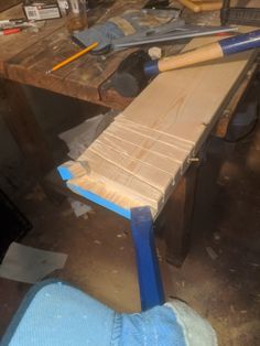 a wooden bench being worked on in a workshop