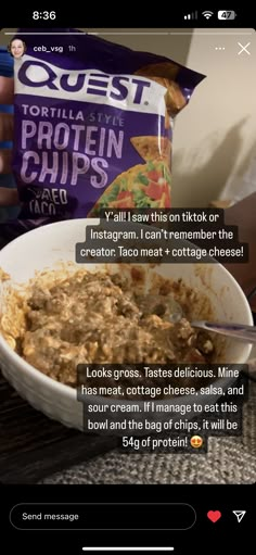 a bowl of food that is sitting on top of a table next to a bag of chips