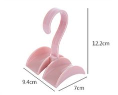 a pink flamingo shaped object is shown with measurements for the height and width of it