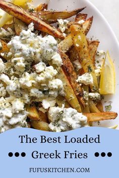 the best loaded greek fries with feta cheese and lemon wedges on a white plate