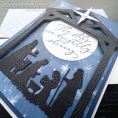 a christmas card made with the silhouettes of two people