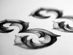 some type of art work that is done in pencil and ink, with the letter g on it