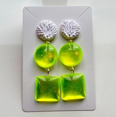 matte white carved textured studs with high gloss neon yellow tinted resin Bold Resin Jewelry For Gifts, Bold White Jewelry For Gifts, Bold White Jewelry For Gift, Bold Resin Jewelry For Gift, Trendy Yellow Hypoallergenic Jewelry, Trendy Yellow Earrings, Trendy Hypoallergenic Yellow Jewelry, Trendy Pierced Resin Jewelry, Trendy Lime Green Jewelry For Gift