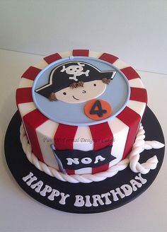 a birthday cake with a pirate theme on the top and number 4 on the bottom