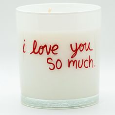 i love you so much candle with red writing on the front and bottom, in a clear glass container