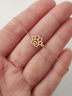 Tiny Dog Paw Print Bracelet 9K 14K Solid gold bracelet | Etsy Gold Sterling Silver Jewelry With Paw Print, Gold Paw Print Jewelry For Best Friend Gift, Gold Paw Print Jewelry For Best Friend, Gold Jewelry With Paw Print For Anniversary, Gold Paw Print Jewelry For Mother's Day, Mother's Day Gold Paw Print Jewelry, Hypoallergenic Gold Jewelry For Best Friend Gift, Adjustable Paw Print Jewelry Gift, Adjustable Paw Print Jewelry As Gift