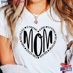 a woman wearing a t - shirt with the words mom printed on it's chest