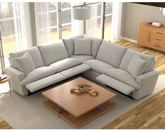 a living room with a sectional couch and coffee table