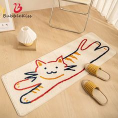 a cat rug on the floor with slippers next to it