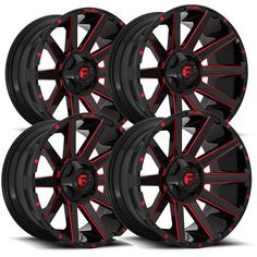 four black and red wheels are shown in this image, with the word f on them