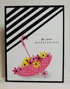 a card with an umbrella and flowers on it