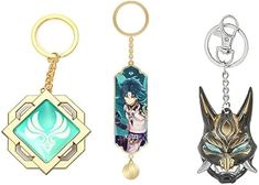 three different key chains with anime characters on them, one in gold and the other in silver