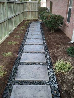 a walkway made out of stones and gravel