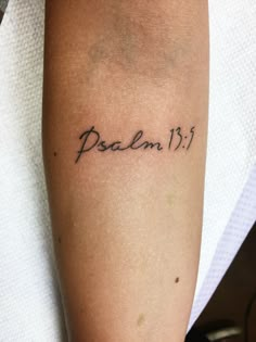 a person with a tattoo on their arm that reads, psalm 13 1 and has the word