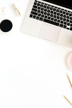 an open laptop computer sitting on top of a white desk