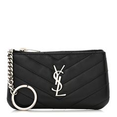 a black bag with a silver ring on the front and an y logo on the back