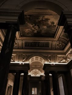 the ceiling is decorated with paintings and columns