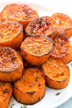 a white plate topped with sliced up sweet potatoes