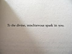 an old typewriter with the words to the divine, mischeous spark in you