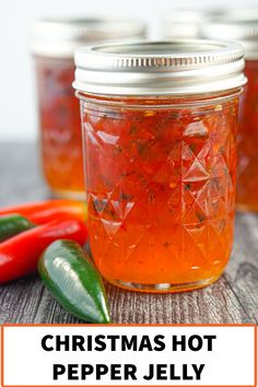 christmas hot pepper jelly in a glass jar with peppers and jalapenos around it