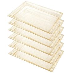 four clear plastic trays stacked on top of each other