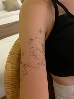 a woman with a tattoo on her arm